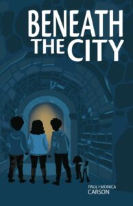 The cover of the book. Two young teen boys, their Goldendoodle, and a young teen girl are staring down the opening of an underground tunnel.